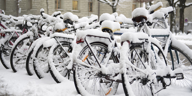 Bicycles under the snow are pictured in Bern, Switzerland, Tuesday, Jan. 10, 2017. (Anthony Anex/Keystone via AP)