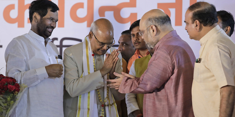 India's new president Ram Nath Kovind, second left, receives greetings from Bharatiya Janata Party president Amit Shah, second right, and other leaders after being elected by the Indian Parliament and state legislatures in voting held Monday, with the results announced 