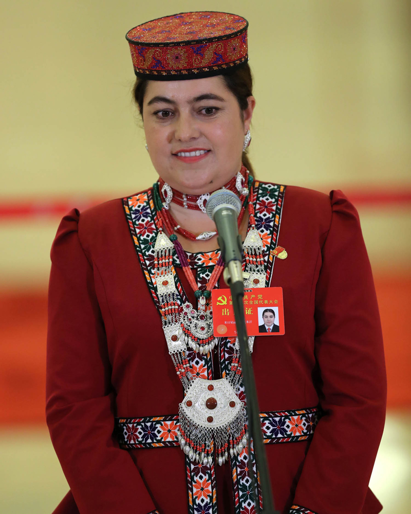 (171018) -- BEIJING, Oct. 18, 2017 (Xinhua) -- Mirigul Hekimihan, a delegate to the 19th National Congress of the Communist Party of China (CPC), receives interview at the Great Hall of the People in Beijing, capital of China, Oct. 18, 2017. The congress will open Wednesday morning. (Xinhua/Yin Gang) (wyo)