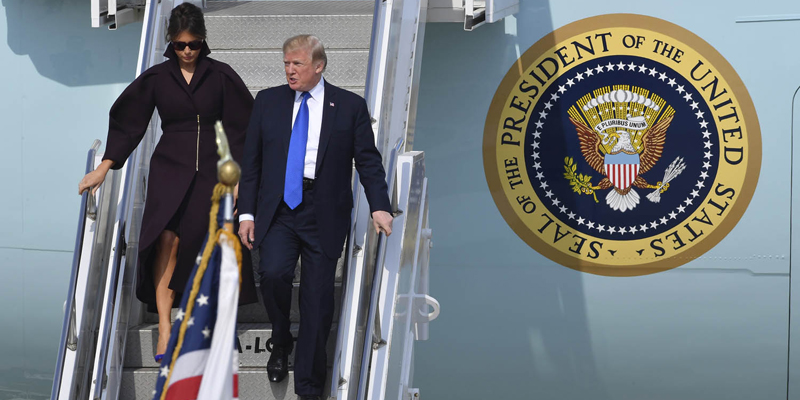 U.S. President Donald Trump, right, and first lady Melania Trump, left, walk down the steps of Air Force One on their arrival at the Osan Air Base in Pyeongtaek, South Korea, Tuesday, Nov. 7, 2017. President Trump arrived in South Korea on Tuesday, beginning a two-day visit centered on pressuring the nation's neighbor to the north to abandon its nuclear weapons program. (Song Kyung-seok/Pool Photo via AP)